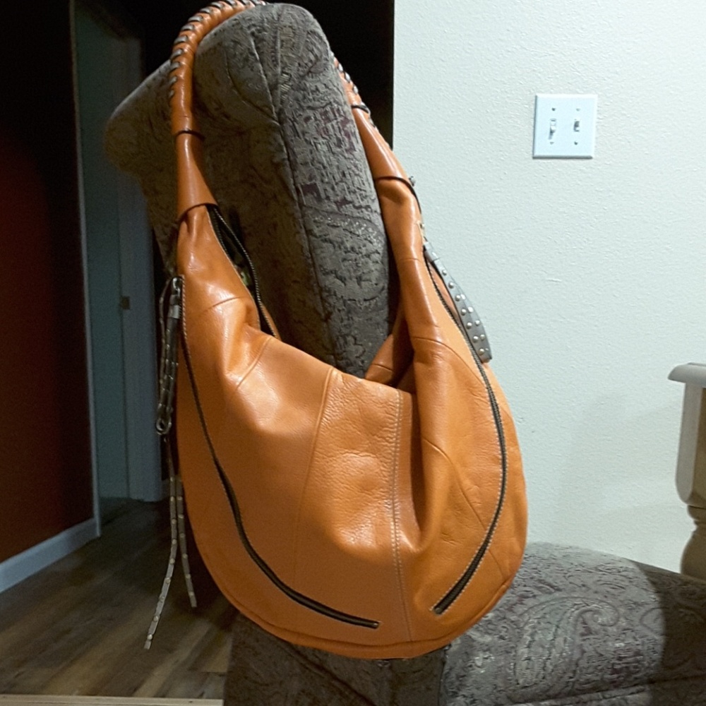 Orayany Orange with tan stitching hobo